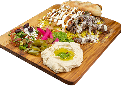Mixed Shawarma Plate with marinated chicken and beef on fragrant rice, served with salad, hummus, warm pita, and tahini or garlic sauce